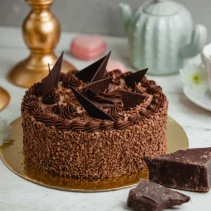 chocolate delight cake decorated with chocolate pieces